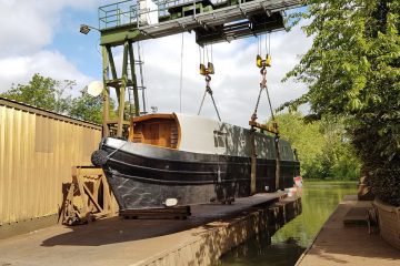 canal boat hire lowered into water