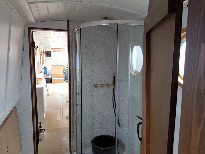 mosaic tiled shower being built on the narrowboat