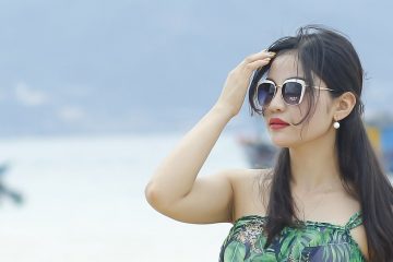 woman wearing sunglasses on a boating holiday
