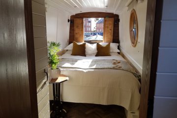 The king sized bed on boutique narrowboat at union wharf for narrowboat holidays 2022