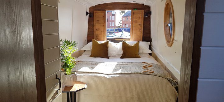 King sized bed on luxury canalboat for hire 