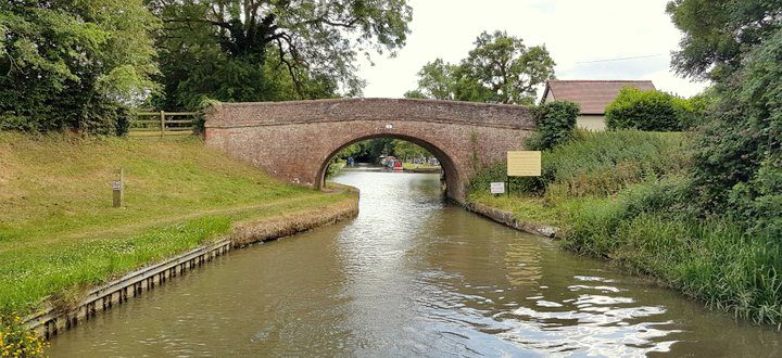 Canal boat going through bridge