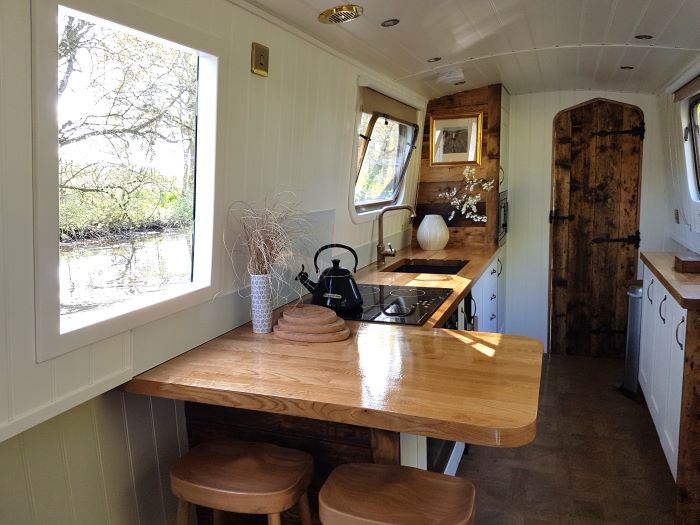Kitchen including breakfast bar on a boutique narrowboat